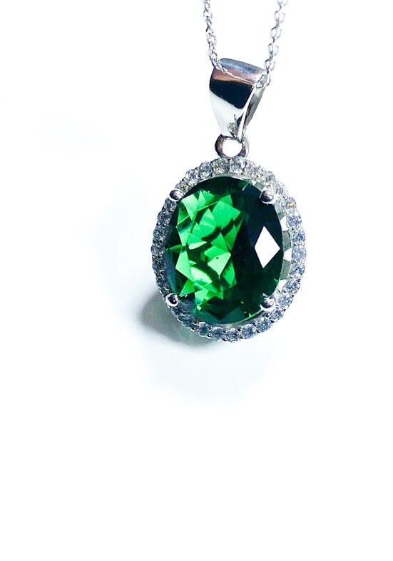 Sterling Silver Classic Oval Design CZ Pendant with CZ Stone Accent and Elegant Bail