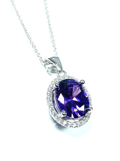 Sterling Silver Classic Oval Design CZ Pendant with CZ Stone Accent and Elegant Bail