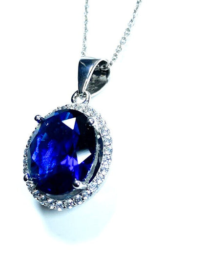 Sterling Silver Classic Oval Design CZ Pendant with CZ Stone Accent and Elegant Bail