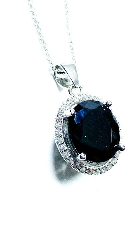 Sterling Silver Classic Oval Design CZ Pendant with CZ Stone Accent and Elegant Bail