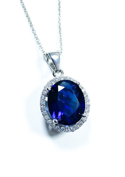 Sterling Silver Classic Oval Design CZ Pendant with CZ Stone Accent and Elegant Bail