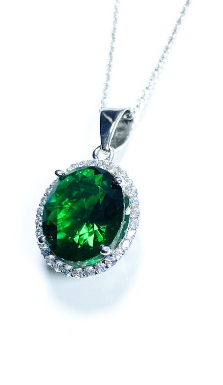 Sterling Silver Classic Oval Design CZ Pendant with CZ Stone Accent and Elegant Bail