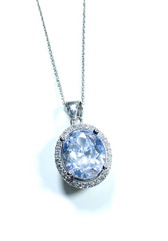 Sterling Silver Classic Oval Design CZ Pendant with CZ Stone Accent and Elegant Bail