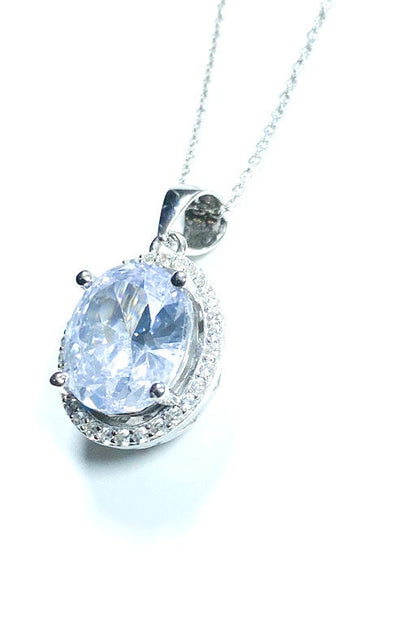 Sterling Silver Classic Oval Design CZ Pendant with CZ Stone Accent and Elegant Bail