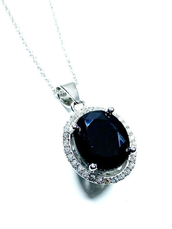 Sterling Silver Classic Oval Design CZ Pendant with CZ Stone Accent and Elegant Bail