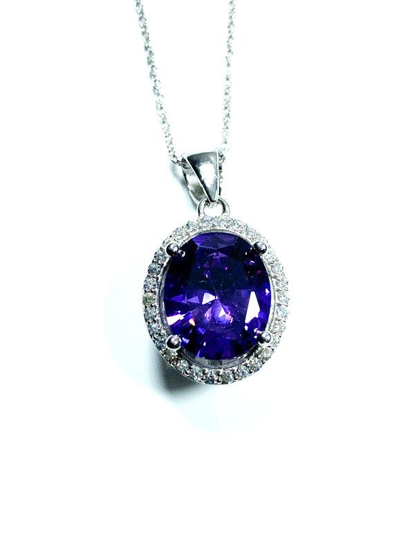 Sterling Silver Classic Oval Design CZ Pendant with CZ Stone Accent and Elegant Bail